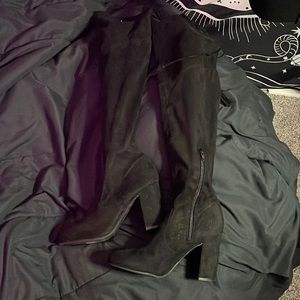 Thigh high heeled boots